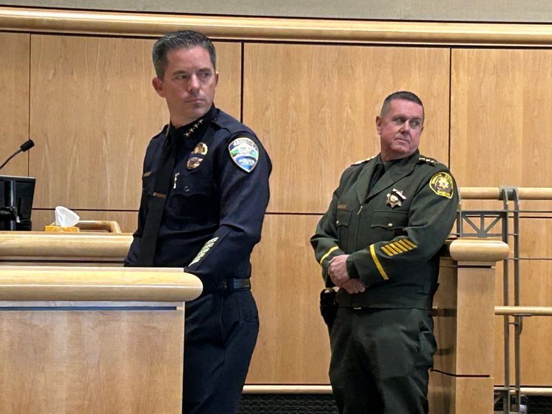 Redding Police Chief Brian Barner and Shasta County Sheriff Michael Johnson listen during the second public safety summit before the Shasta County Board of Supervisors on March 24, 2025.