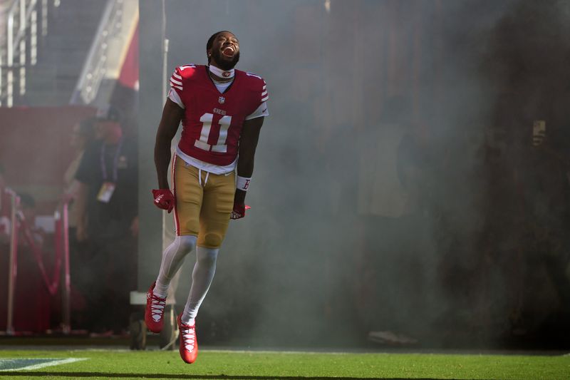 Sep 9, 2024; Santa Clara, California, USA; San Francisco 49ers wide receiver Brandon Aiyuk (11) is introduced to the crowd before the game against the New York Jets at Levi's Stadium. Mandatory Credit: Darren Yamashita-Imagn Images