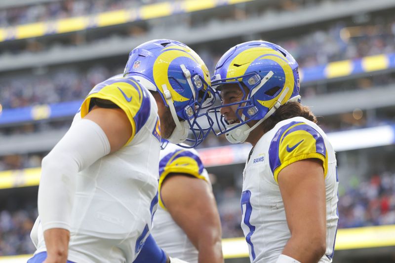 Dec 3, 2023; Inglewood, California, USA; Los Angeles Rams quarterback Mathew Stafford (9) celebrates with Los Angeles Rams wide receiver Puka Nacua (17) after scoring a touchdown in the first half in a game against the Cleveland Browns at SoFi Stadium. Mandatory Credit: Yannick Peterhans-USA TODAY Sports