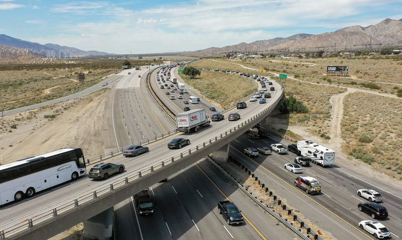 Drivers on Hwy 111, elevated roadway, slowly merge with westbound Interstate 10 traffic the day after the conclusion of the Coachella Valley Music and Arts Festival near Whitewater, Calif., April 14, 2025.