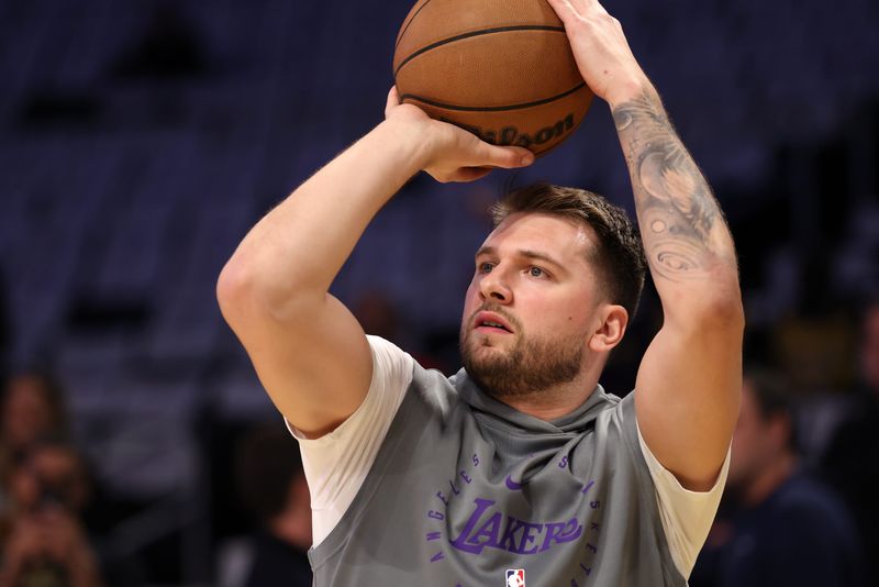Apr 22, 2025; Los Angeles, California, USA; Los Angeles Lakers guard Luka Doncic (77) warms up before a game two of first round for the 2024 NBA Playoffs against the Minnesota Timberwolves at Crypto.com Arena. Mandatory Credit: Kiyoshi Mio-Imagn Images