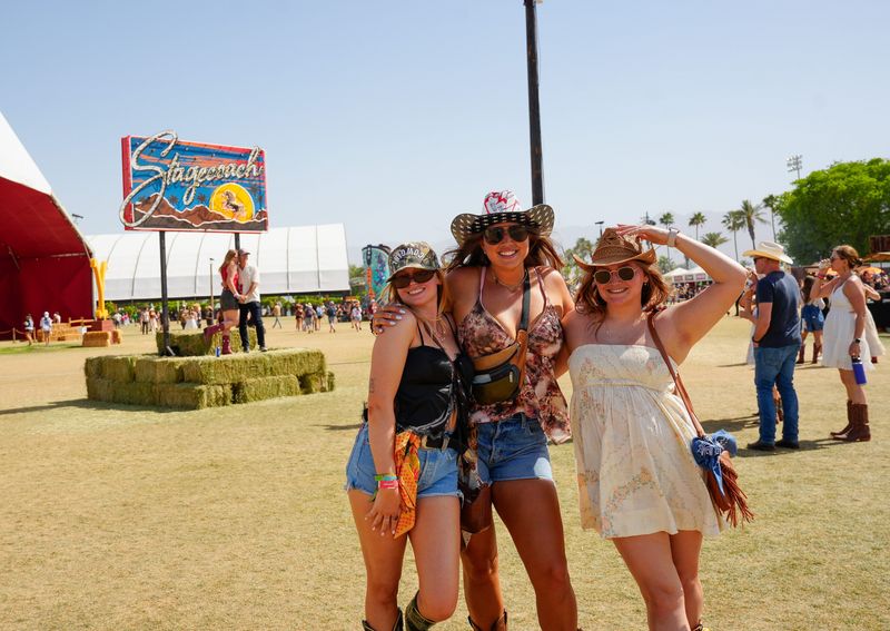 Festivalgoers pause for a photograph during the first day of the Stagecoach Festival in Indio, Calif., April 25, 2025.