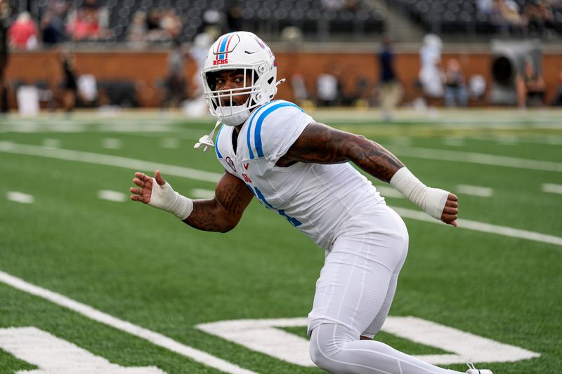 Sep 14, 2024; Winston-Salem, North Carolina, USA; Mississippi Rebels linebacker Chris Paul Jr. (11) during pregame activity against the Wake Forest Demon Deacons at Allegacy Federal Credit Union Stadium. Mandatory Credit: Jim Dedmon-Imagn Images