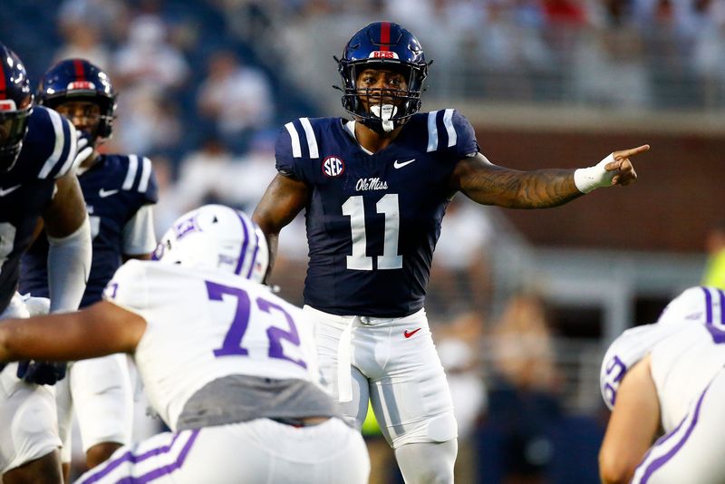 Aug 31, 2024; Oxford, Mississippi, USA; Mississippi Rebels linebacker Chris Paul Jr. (11) gives direction prior to the snap against the Furman Paladins during the first half at Vaught-Hemingway Stadium. Mandatory Credit: Petre Thomas-USA TODAY Sports