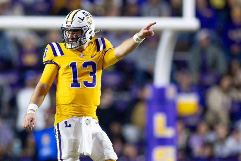 Nov 23, 2024; Baton Rouge, Louisiana, USA; LSU Tigers quarterback Garrett Nussmeier (13) signals a first down against the Vanderbilt Commodores during the second half at Tiger Stadium. Mandatory Credit: Stephen Lew-Imagn Images