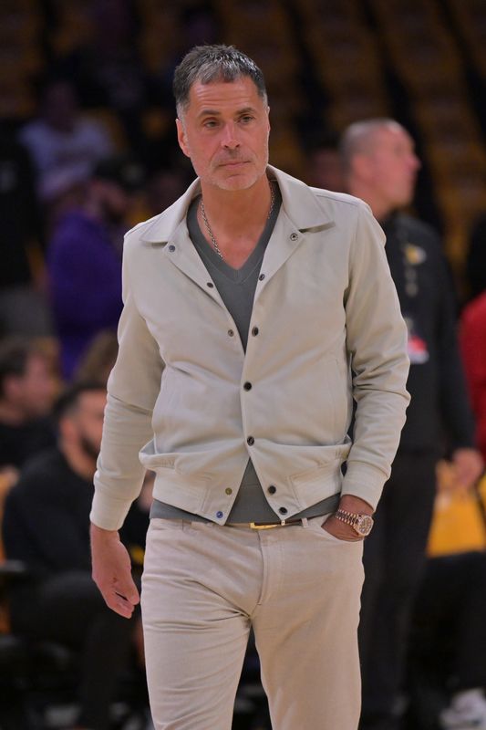 Apr 19, 2025; Los Angeles, California, USA; Los Angeles Lakers general manager Rob Pelinka walks on the couet prior to the game against the Minnesota Timberwolves at Crypto.com Arena. Mandatory Credit: Jayne Kamin-Oncea-Imagn Images