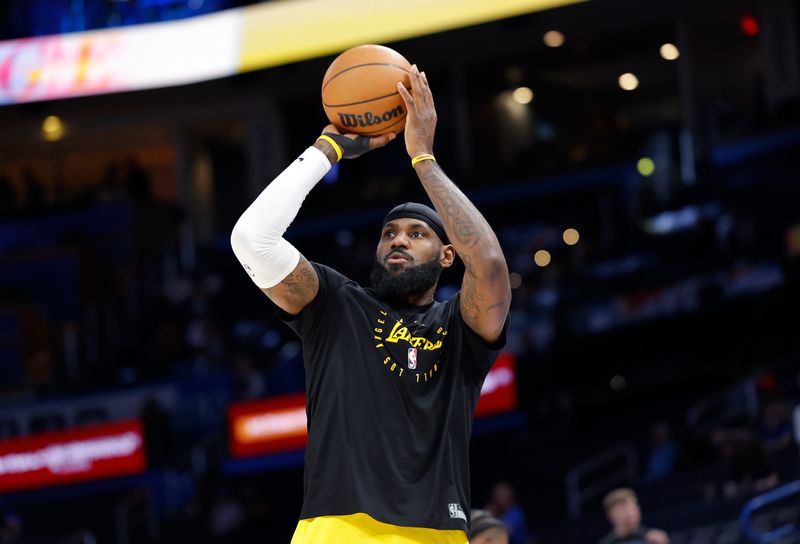 Apr 8, 2025; Oklahoma City, Oklahoma, USA; Los Angeles Lakers forward LeBron James warms up before the start of a game against the Oklahoma City Thunder at Paycom Center. Mandatory Credit: Alonzo Adams-Imagn Images
