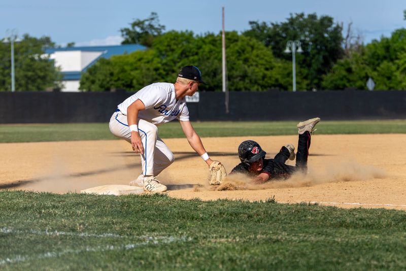 U-Prep third baseman Jack Ampi tags Colusa's Mason Gutierrez out as he tries to steal third.