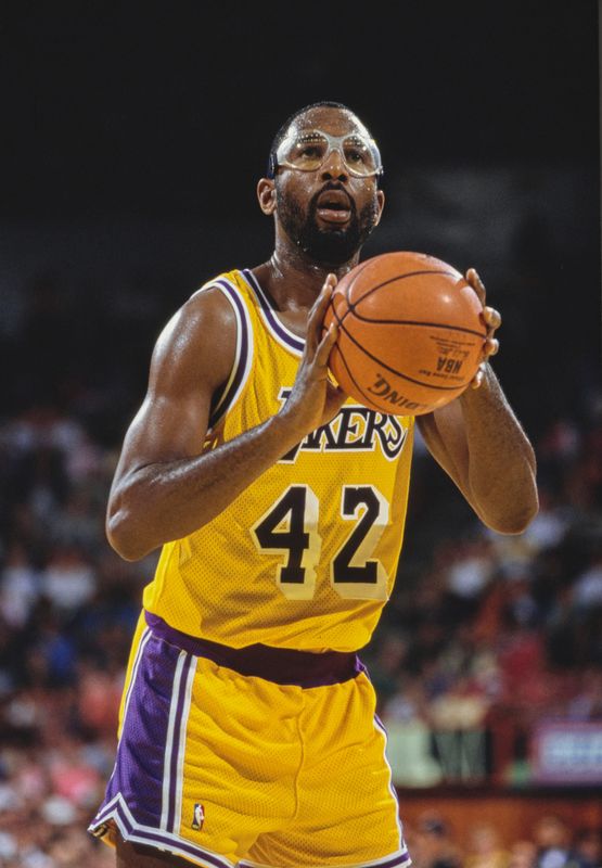 James Worthy #42, Small Forward and Power Forward for the Los Angeles Lakers prepares to shoot a free throw during the NBA Pacific Division basketball game against the New York Knicks on 11th November 1990 at the Great Western Forum arena in Inglewood, Los Angeles, California, United States. The Knicks won the game 109 - 103. (Photo by Otto Greule Jr/Allsport/Getty Images)