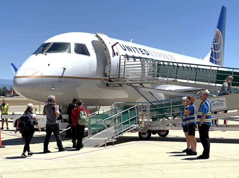 Passengers get ready to board the inaugural United Airlines flight from Redding Regional Airport to Denver International Airport on Thursday, May 22, 2025.