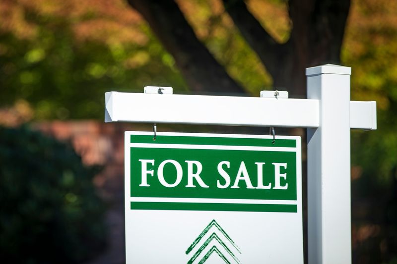 A for sale sign advertises a home in the Harlow Neighborhood in Eugene, Oregon.