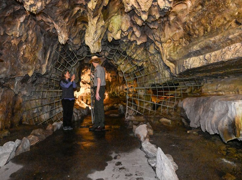 Savannah Boiano, Executive Director, Sequoia Parks Conservancy, left, and Clay Jordan, Superintendent for Sequoia and Kings Canyon National Parks, open the gate to Crystal Cave for a media tour on Thursday, May 22, 2025. Crystal cave tours are operated by Sequoia Parks Conservancy in partnership with the National Park Service. The cave has been closed for four years due to both fire and severe weather.