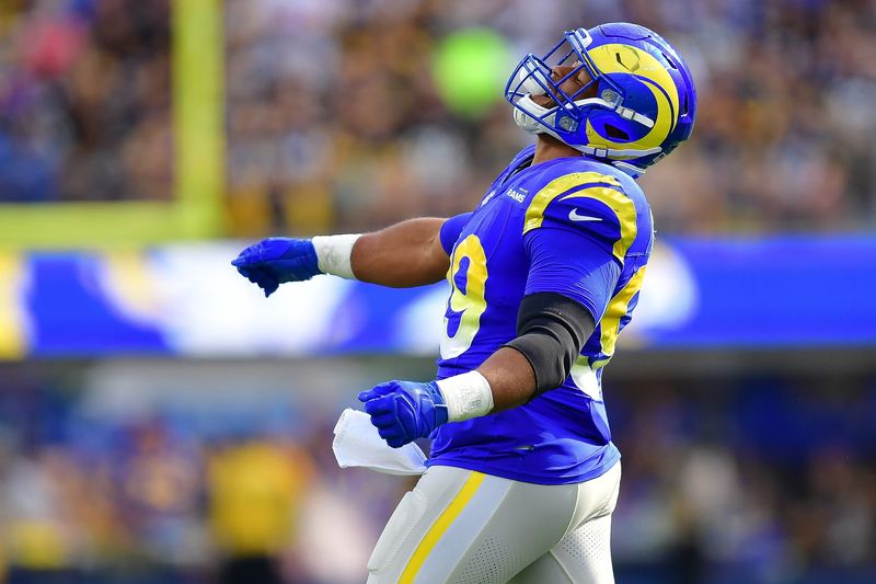Oct 22, 2023; Inglewood, California, USA; Los Angeles Rams defensive tackle Aaron Donald (99) reacts against the Pittsburgh Steelers during the second half at SoFi Stadium. Mandatory Credit: Gary A. Vasquez-USA TODAY Sports