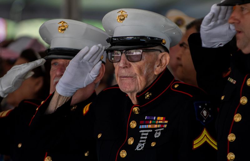Retired Marine corporal Frank Wright, 99, salutes during national anthem at the Memorial Day observances at Cherokee Memorial Park in Lodi on May 26, 2025.