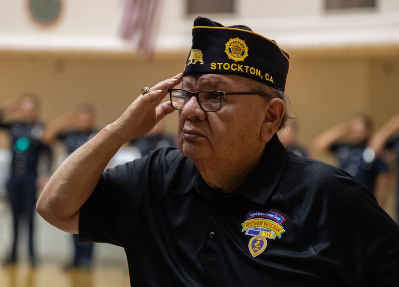 Vietnam Veteran Tino Adame salutes during the VFW Luneta Post 52 Memorial Day observance at the Stockton Memorial Civic Auditorium in downtown Stockton on May 26, 2025.