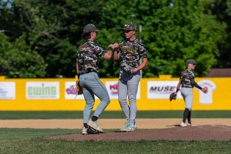 West Valley third baseman Mason McFadden fist bumps pitcher Jayden Knight.