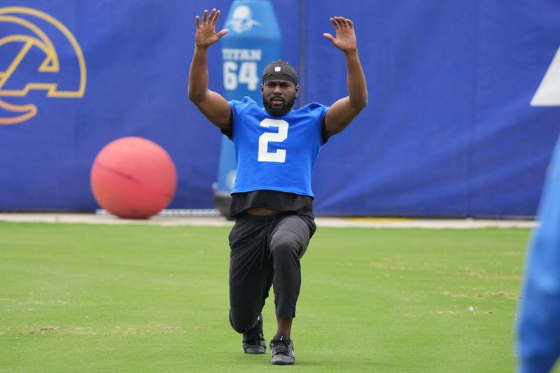May 28, 2025; Woodland Hills, CA, USA; Los Angeles Rams wide receiver Quintet Cephus (2) works out with a weighted ball during organized team activities at Rams Practice Facility. Mandatory Credit: Kirby Lee-Imagn Images