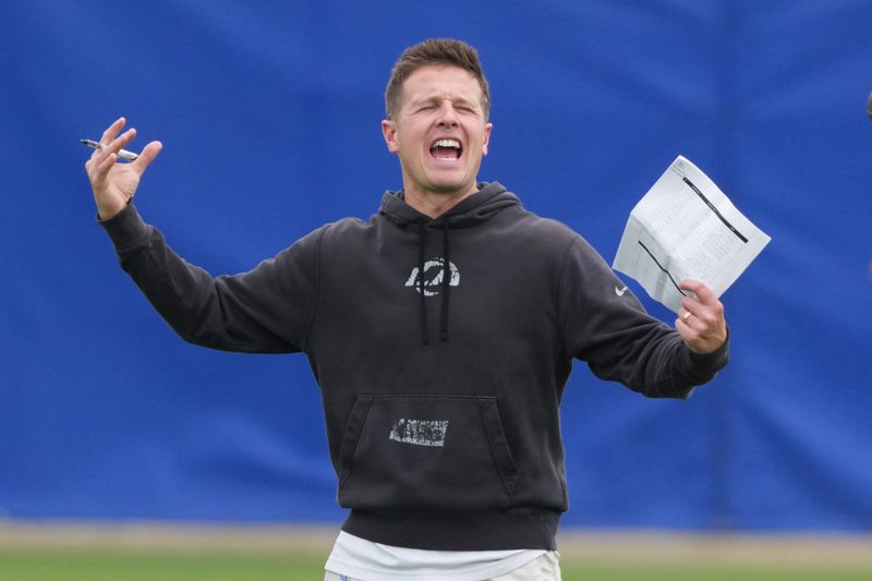 May 28, 2025; Woodland Hills, CA, USA; Los Angeles Rams offensive coordinator Mike LaFleur watches during organized team activities at Rams Practice Facility. Mandatory Credit: Kirby Lee-Imagn Images