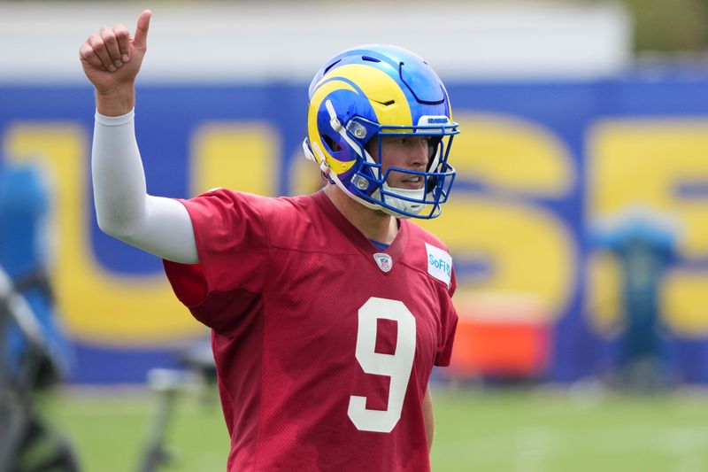 May 28, 2025; Woodland Hills, CA, USA; Los Angeles Rams quarterback Matthew Stafford (9) gestures during organized team activities at Rams Practice Facility. Mandatory Credit: Kirby Lee-Imagn Images