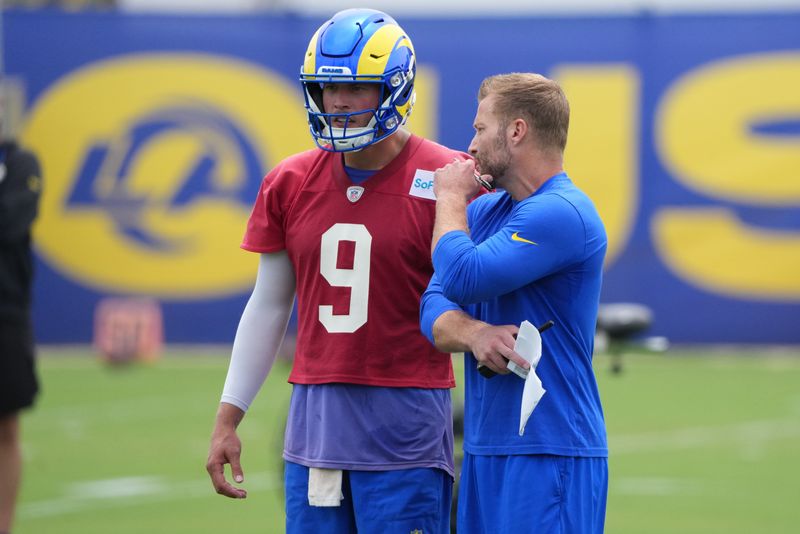 May 28, 2025; Woodland Hills, CA, USA; Los Angeles Rams head coach Sean McVey talks to quarterback Matt Stafford (9) during organized team activities at Rams Practice Facility. Mandatory Credit: Kirby Lee-Imagn Images