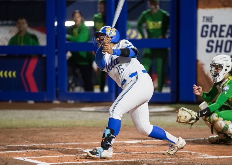 May 29, 2025; Oklahoma City, OK, USA; UCLA Bruins infielder Jordan Woolery (15) hits a fly ball out to center field for an out in the first inning against the Oregon Ducks during the NCAA Softball Women's College World Series at Devon Park. Mandatory Credit: Brett Rojo-Imagn Images