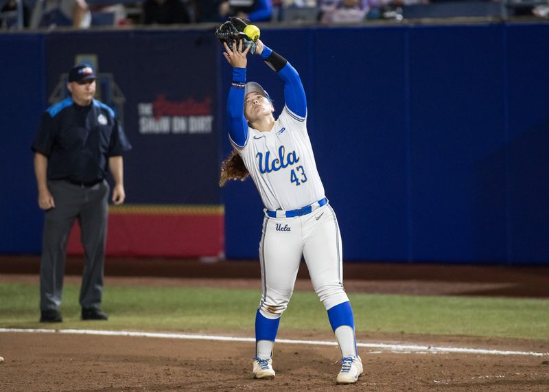 May 29, 2025; Oklahoma City, OK, USA; UCLA Bruins utility Megan Grant (43) makes an out in the second inning against the Oregon Ducks during the NCAA Softball Women's College World Series at Devon Park. Mandatory Credit: Brett Rojo-Imagn Images