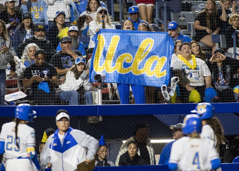 May 29, 2025; Oklahoma City, OK, USA; UCLA Bruins fans cheer in the sixth inning against the Oregon Ducks during the NCAA Softball Women's College World Series at Devon Park. Mandatory Credit: Brett Rojo-Imagn Images