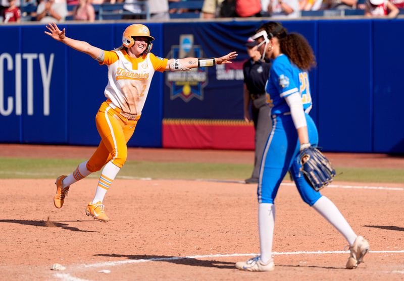 Tennessee's Laura Mealer (2) celebrates driving in the winning run in the 9th inning next to UCLA's Taylor Tinsley (23) the Women's College World Series softball game between the UCLA Bruins and the Tennessee Volunteers at Devon Park in Oklahoma City, Sunday, June, 1, 2025.
