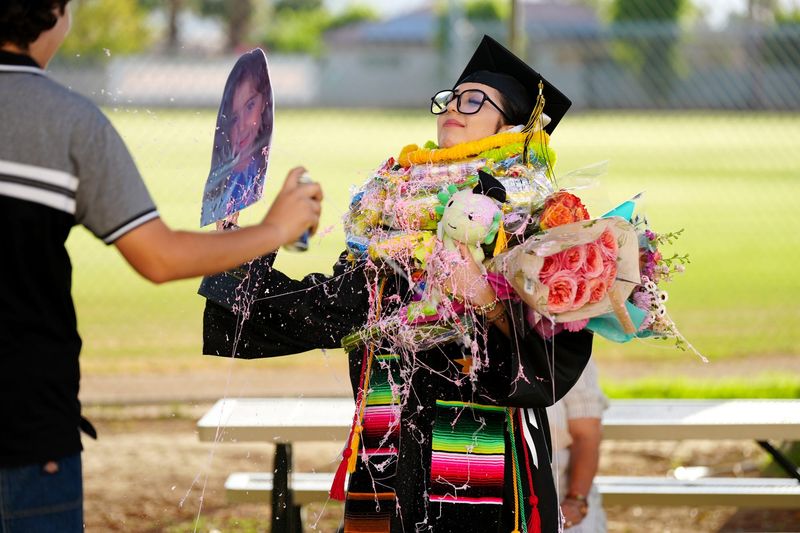 Graduate Vienna Ramirez gets festive after the Summit High School commencement ceremony in Palm Desert, Calif., on Mon., June 2, 2025.