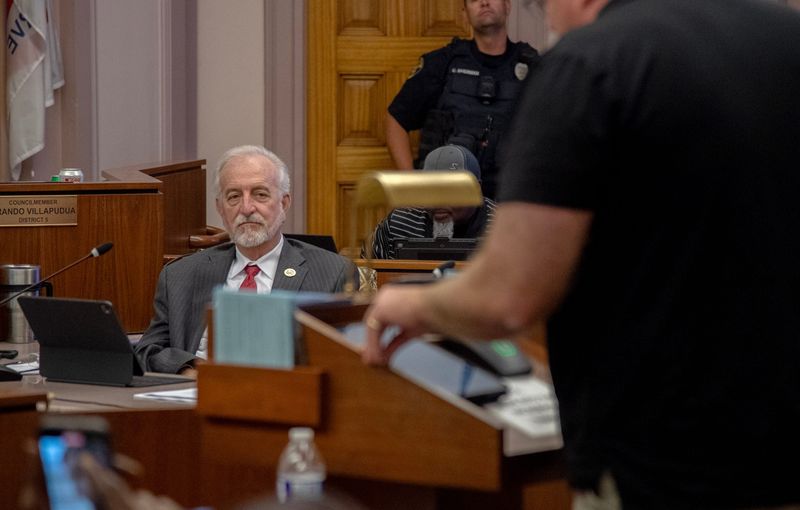 Stockton Interim City Manager Steve Colangelo, left, listens to criticism during public comment at a Stockton City Council meeting at city hall in downtown Stockton on Tuesday, June 3, 2025.