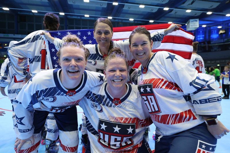 Left to right: Amanda Hardwick, Katie Petronio (back row), Danielle Standard, and Tawny Cowell of the USA’s Women’s Masters Inline Hockey World Cup team celebrate after defeating France on Friday, May 30, in Garmisch-Partenkirchen, Germany.