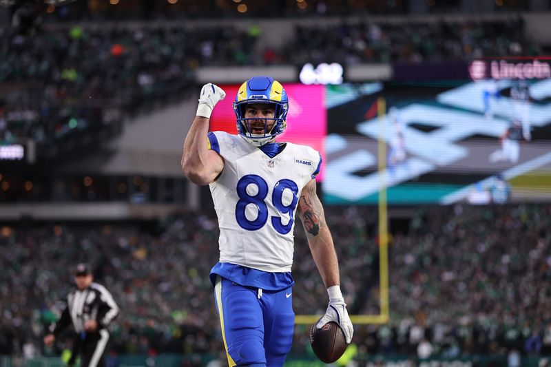 Jan 19, 2025; Philadelphia, Pennsylvania, USA; Los Angeles Rams tight end Tyler Higbee (89) celebrates after scoring a touchdown in the first quarter against the Philadelphia Eagles in a 2025 NFC divisional round game at Lincoln Financial Field. Mandatory Credit: Bill Streicher-Imagn Images