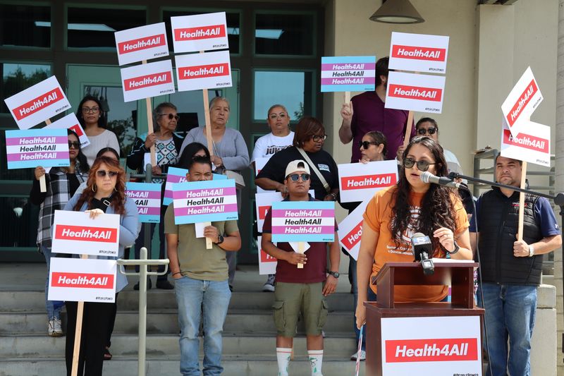 The Health4All Coalition rallies outside Assembly Speaker Robert Rivas Office in Salinas to protest Gov. Newsom's revised budget that would rollback Medi-Cal expansion to certain immigrant adults on June 5, 2025.