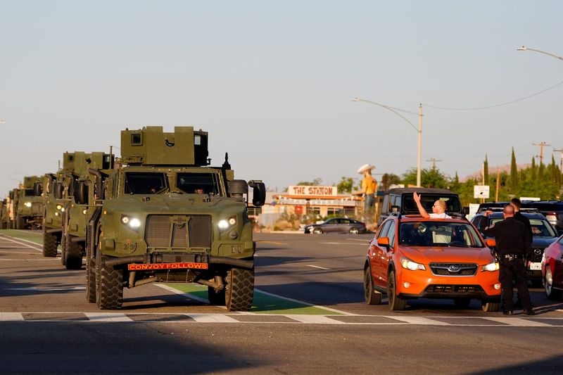 A convoy of Marines from the Twentynine Palms base en route to the greater Los Angeles area pass Park Boulevard along Highway 62 in Joshua Tree, Calif., on June 9, 2025.