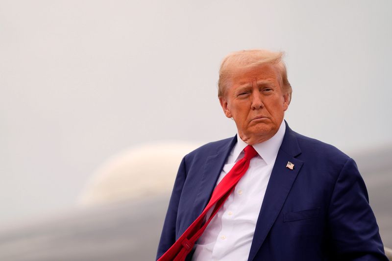 Former President Donald Trump disembarks from his plane at the Augusta Regional Airport on Friday, Oct. 4, 2024. Trump came to get a briefing on Hurricane Helene and speak to supporters.