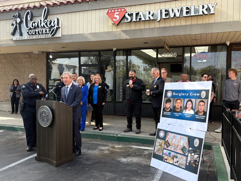 Ventura County District Attorney Erik Nasarenko addresses the media at a news conference on June 13 announcing the arrest of four suspects in the May 25 burglary of 5 Star Jewelry in Simi Valley. Next to him at the podium is Simi Valley Police Chief Steve Shorts.