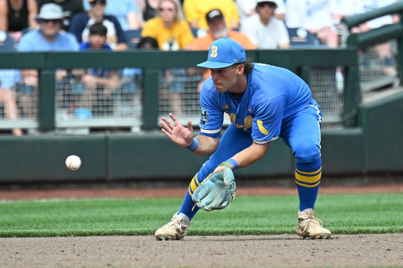 Jun 14, 2025; Omaha, Neb, USA; UCLA Bruins shortstop Roch Cholowsky (1) fields a ground ball against the Murray State Racers during the ninth inning at Charles Schwab Field. Mandatory Credit: Steven Branscombe-Imagn Images