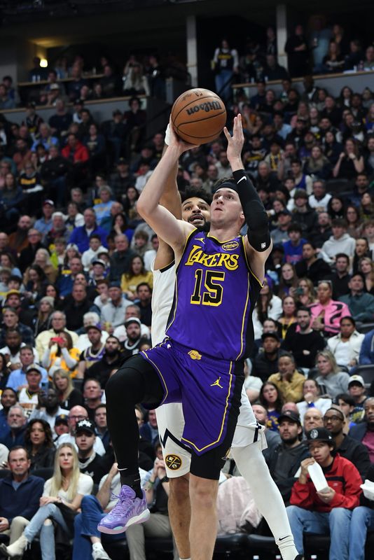 Feb 22, 2025; Denver, Colorado, USA; Los Angeles Lakers guard Austin Reaves (15) shoots the ball along the baseline during the second half against the Denver Nuggets at Ball Arena. Mandatory Credit: Christopher Hanewinckel-Imagn Images