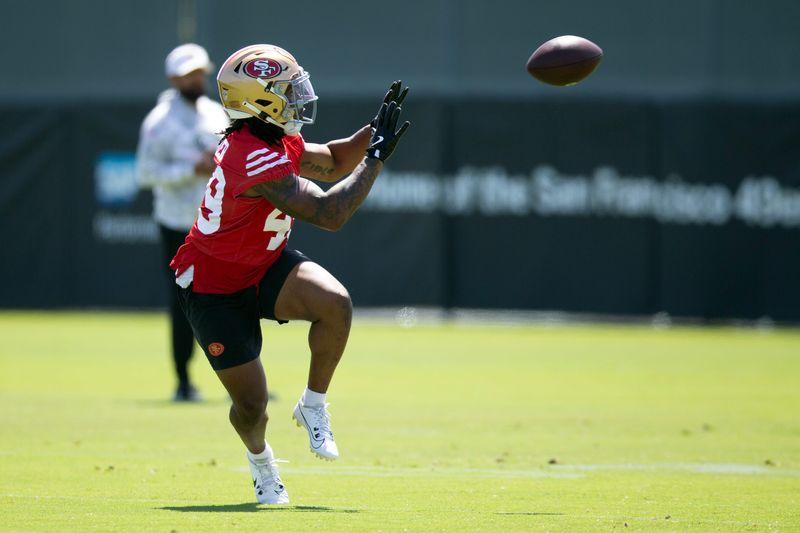 Jun 11, 2025; Santa Clara, CA, USA; San Francisco 49ers running back Corey Kiner (49) catches a pass during a team OTA at Levi's Stadium. Mandatory Credit: D. Ross Cameron-Imagn Images