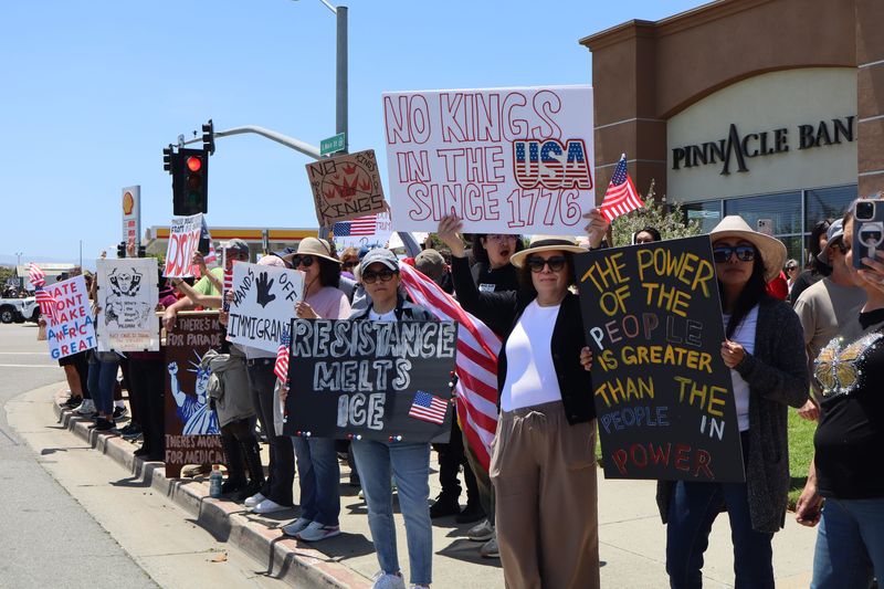 Salinas, Calif. on the nationwide "No Kings Day of Defiance" June 14, 2025. Crowds lined South Main St. from Blanco Road to San Miguel Ave, waving American flags, holding protest signs, and chanting words of protest to passing motorists, many honking in support.