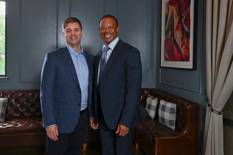 New PGA Tour CEO Brian Rolapp (left) with Tiger Woods.