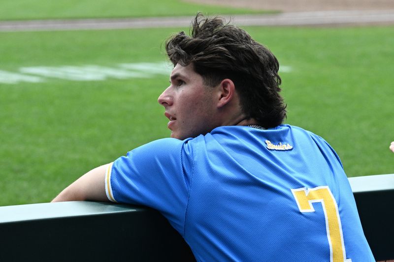 Jun 17, 2025; Omaha, Neb, USA; UCLA Bruins third baseman Roman Martin (7) cheers action against the LSU Tigers during the eighth inning at Charles Schwab Field. Mandatory Credit: Steven Branscombe-Imagn Images