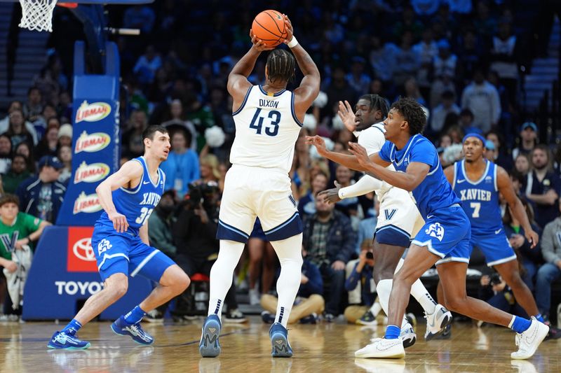 Feb 9, 2025; Philadelphia, Pennsylvania, USA; Villanova Wildcats forward Eric Dixon (43) shoots the ball against the Xavier Musketeers in the first half at Wells Fargo Center. Mandatory Credit: Kyle Ross-Imagn Images
