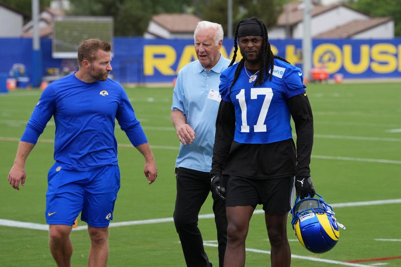 May 28, 2025; Woodland Hills, CA, USA; Los Angeles Rams coach Sean McVay (left) and receiver Davante Adams (17) talks with sports agent Frank Bauer (center) during organized team activities at Rams Practice Facility. Mandatory Credit: Kirby Lee-Imagn Images