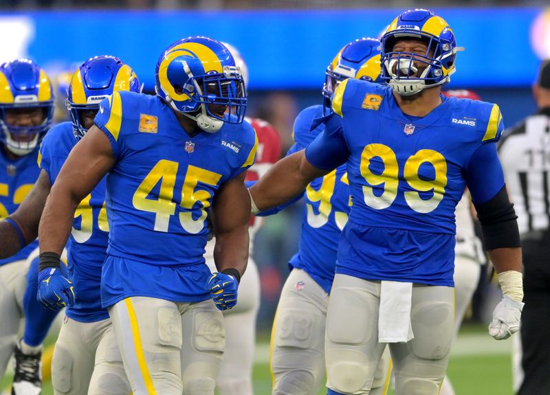 Nov 13, 2022; Inglewood, California, USA; Los Angeles Rams linebacker Bobby Wagner (45) celebrates with defensive tackle Aaron Donald (99) after a sack in the second half at SoFi Stadium. Mandatory Credit: Jayne Kamin-Oncea-USA TODAY Sports