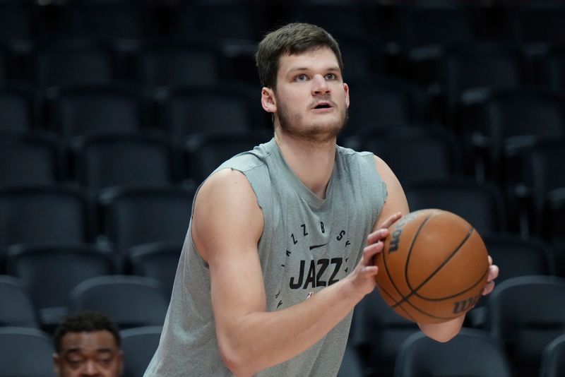 Dec 26, 2024; Portland, Oregon, USA; Utah Jazz center Walker Kessler (24) warms up before the game against the Portland Trail Blazers at Moda Center. Mandatory Credit: Soobum Im-Imagn Images