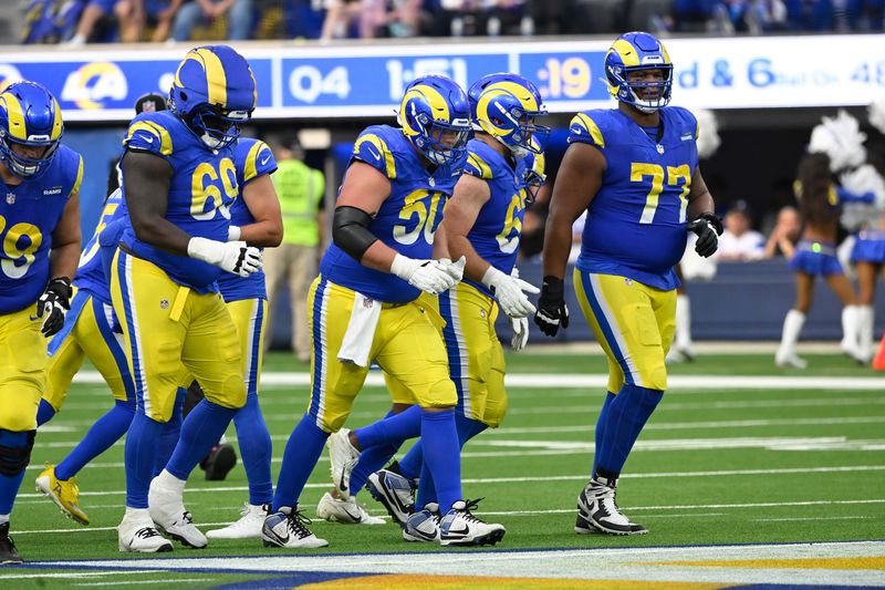 Oct 20, 2024; Inglewood, California, USA; Los Angeles Rams guard Kevin Dotson (69), Los Angeles Rams center Beaux Limmer (50), Los Angeles Rams guard Justin Dedich (67) and Los Angeles Rams offensive tackle Alaric Jackson (77) during the fourth quarter against the Las Vegas Raiders at SoFi Stadium. Mandatory Credit: Robert Hanashiro-Imagn Images