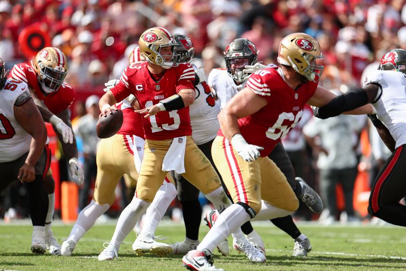 Nov 10, 2024; Tampa, Florida, USA; San Francisco 49ers quarterback Brock Purdy (13) drops back to pass against the Tampa Bay Buccaneers in the second quarter at Raymond James Stadium. Mandatory Credit: Nathan Ray Seebeck-Imagn Images