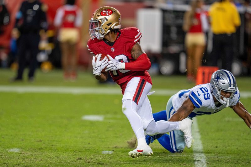 Oct 27, 2024; Santa Clara, California, USA; San Francisco 49ers wide receiver Jacob Cowing (19) on a runback against Dallas Cowboys cornerback C.J. Goodwin (29) at Levi's Stadium. Mandatory Credit: Neville E. Guard-Imagn Images
