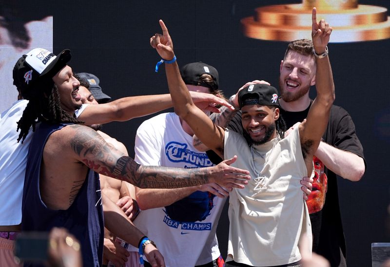 Oklahoma City's Jaylin Williams celebrates with Isaiah Joe at Scissortail Park as the Oklahoma City Thunder celebrate their first NBA Finals title win with a champions parade throughout downtown Oklahoma City on Tuesday, June 24, 2025.